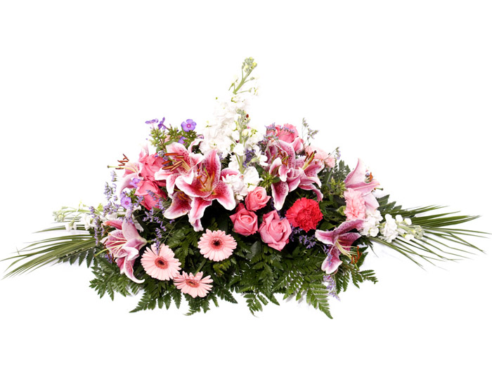 funeral spray with pink lilies